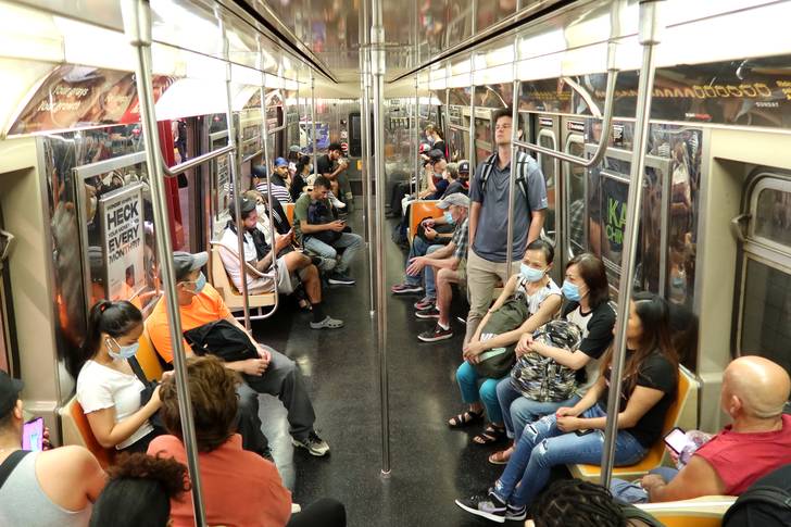 A group of people on a subway train